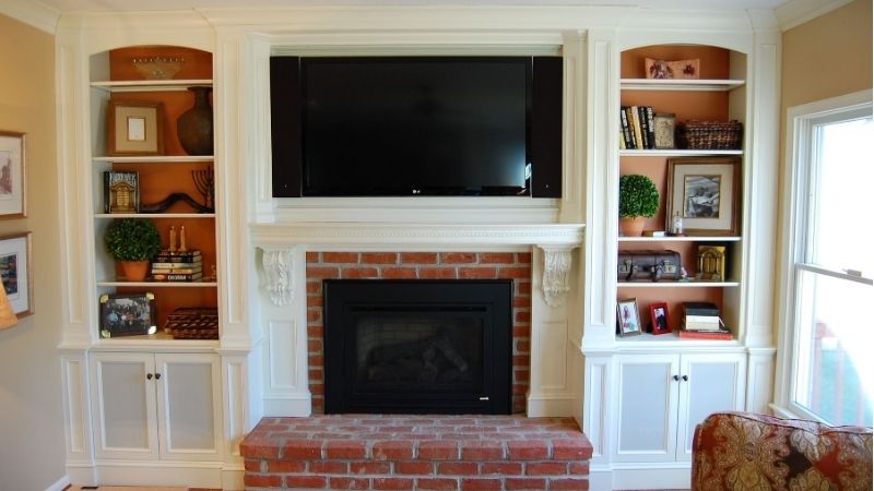 fireplace with mantel and tv